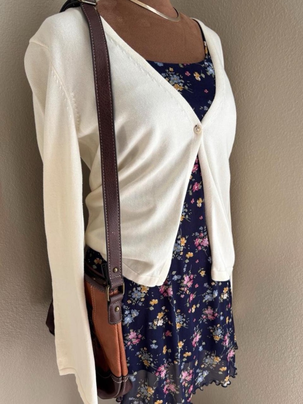 Navy blue floral mini dress with pink, yellow, and white flowers, size L.
